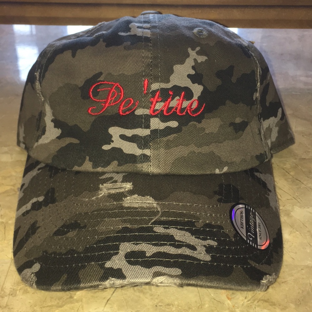 I’m selling camouflage distressed Pe’tite hats